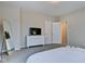 Bedroom with dresser, TV, and full bed at 2450 Carrollton Ave, Indianapolis, IN 46205