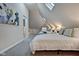 Bright bedroom with a queen bed, featuring an artistic wall accent at 2450 Carrollton Ave, Indianapolis, IN 46205
