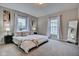 Primary bedroom with king-size bed and grey carpet at 2450 Carrollton Ave, Indianapolis, IN 46205