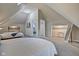 Two twin beds in a spacious attic bedroom at 2450 Carrollton Ave, Indianapolis, IN 46205