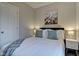 Cozy bedroom with a full-size bed and window at 2450 Carrollton Ave, Indianapolis, IN 46205