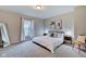 Primary bedroom with king-size bed and grey carpet at 2450 Carrollton Ave, Indianapolis, IN 46205