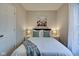 Cozy bedroom with a full-size bed and window at 2450 Carrollton Ave, Indianapolis, IN 46205