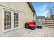 Private deck with seating area and French doors leading inside at 2450 Carrollton Ave, Indianapolis, IN 46205