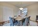 Formal dining room with wood table, gray chairs, and view into kitchen at 2450 Carrollton Ave, Indianapolis, IN 46205