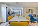 Bright dining room with table and chairs, kitchen view, and modern light fixture at 2450 Carrollton Ave, Indianapolis, IN 46205