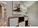 Entryway with modern storage cabinet and abstract art at 2450 Carrollton Ave, Indianapolis, IN 46205