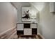 Entryway with mid-century modern cabinet, lamp, and abstract artwork at 2450 Carrollton Ave, Indianapolis, IN 46205