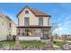 Two-story house with a front porch and brick accents at 2450 Carrollton Ave, Indianapolis, IN 46205