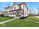 Two-story house with a porch and well-maintained lawn at 2450 Carrollton Ave, Indianapolis, IN 46205