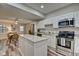 Modern kitchen with stainless steel appliances and white cabinets at 2450 Carrollton Ave, Indianapolis, IN 46205