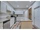 Modern kitchen with stainless steel appliances and white cabinets at 2450 Carrollton Ave, Indianapolis, IN 46205