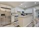 Modern kitchen with stainless steel appliances and white cabinets at 2450 Carrollton Ave, Indianapolis, IN 46205