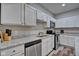 Modern kitchen with white cabinets and granite countertops at 2450 Carrollton Ave, Indianapolis, IN 46205