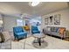 Open concept living room with adjacent kitchen and dining area at 2450 Carrollton Ave, Indianapolis, IN 46205