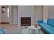 Living room with fireplace and teal sofa at 2450 Carrollton Ave, Indianapolis, IN 46205