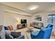 Comfortable living room featuring stylish furniture and a large TV at 2450 Carrollton Ave, Indianapolis, IN 46205