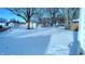 Snowy backyard with shed and trees at 2508 E 4Th St, Anderson, IN 46012