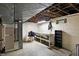 Unfinished basement with workbench and storage at 2934 S Irwin St, Indianapolis, IN 46203