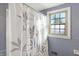 Bathroom with shower and window at 2934 S Irwin St, Indianapolis, IN 46203
