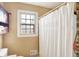 Bathroom features a shower/tub combo and a single window at 2934 S Irwin St, Indianapolis, IN 46203