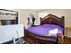 Bedroom with large bed, hardwood floors, and walk-in closet at 2934 S Irwin St, Indianapolis, IN 46203