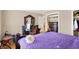 Bedroom with a large bed, hardwood floors, and ample closet space at 2934 S Irwin St, Indianapolis, IN 46203