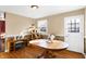 Dining room with a round wooden table and cat tree near the door at 2934 S Irwin St, Indianapolis, IN 46203