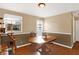 Dining room with round wooden table, hardwood floors, and cat tree at 2934 S Irwin St, Indianapolis, IN 46203