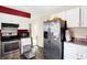 Kitchen features stainless steel appliances and white cabinets at 2934 S Irwin St, Indianapolis, IN 46203