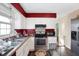 Bright eat-in kitchen with white cabinets and stainless steel appliances at 2934 S Irwin St, Indianapolis, IN 46203