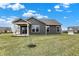 Back exterior showcasing the yard at 3844 Albert Ln, Bargersville, IN 46106