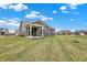 Exterior view of the home showcasing its patio and expansive yard at 3844 Albert Ln, Bargersville, IN 46106