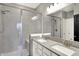 Bathroom featuring a glass enclosed shower, tiled walls and double sink vanity at 3844 Albert Ln, Bargersville, IN 46106