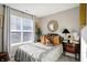 Bright bedroom with large window, and an ornate accent table at 3844 Albert Ln, Bargersville, IN 46106