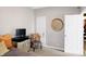 Well-lit bedroom with a TV, chair, and large decorative wall art at 3844 Albert Ln, Bargersville, IN 46106