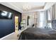 Spacious bedroom with a dark accent wall, large mirror, and ensuite bathroom at 3844 Albert Ln, Bargersville, IN 46106