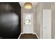 Bright entryway with dark accent wall, stylish lighting, and a white front door with a glass pane at 3844 Albert Ln, Bargersville, IN 46106