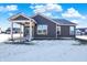 Gray house exterior with covered patio and snowy yard at 3844 Albert Ln, Bargersville, IN 46106