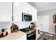 Modern kitchen with white cabinets and stainless steel appliances at 3844 Albert Ln, Bargersville, IN 46106