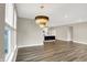 Open concept living space featuring hardwood floors, neutral paint, and an open view to kitchen at 3844 Albert Ln, Bargersville, IN 46106