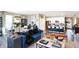 Open living room showcasing stylish furniture, a fireplace, and large windows at 3844 Albert Ln, Bargersville, IN 46106