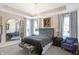 Serene main bedroom with a gray upholstered bed and sitting area at 3844 Albert Ln, Bargersville, IN 46106