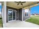 Relaxing covered patio with ceiling fan and outdoor lighting, perfect for entertaining at 3844 Albert Ln, Bargersville, IN 46106