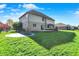 A spacious, grassy backyard is perfect for outdoor play at 386 White Oak Ln, Greenwood, IN 46142