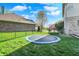 A spacious backyard with lush green grass and trampoline at 386 White Oak Ln, Greenwood, IN 46142
