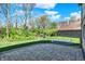 A spacious backyard with lush green grass and patio at 386 White Oak Ln, Greenwood, IN 46142