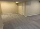 Spacious carpeted basement with neutral walls, a versatile area for various activities at 386 White Oak Ln, Greenwood, IN 46142
