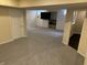 Finished basement featuring neutral carpeting, a TV, and ample space for entertaining and recreation at 386 White Oak Ln, Greenwood, IN 46142