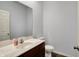 Clean bathroom features a modern sink, vanity, and toilet, offering a functional and well-lit space at 386 White Oak Ln, Greenwood, IN 46142